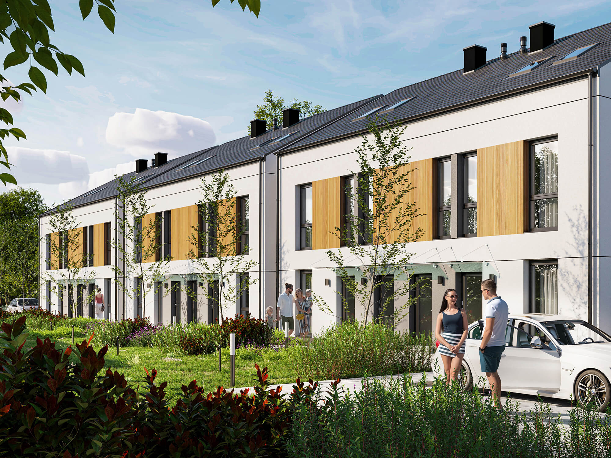 Osiedle z bliźniakami z parkingiem w otoczeniu zieleni.