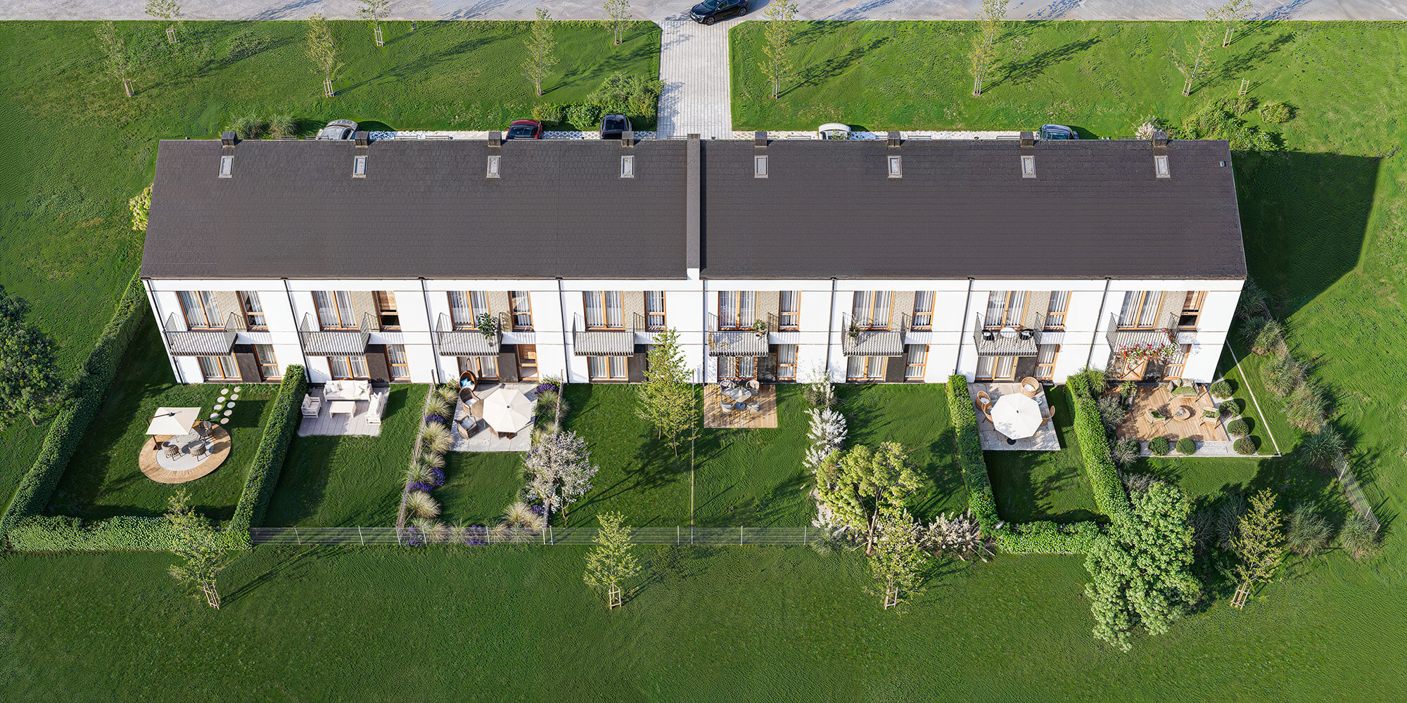 Wizualizacje 3D inwestycji Malinova Park - osiedle z domem szeregowym i ogródkami z lotu ptaka