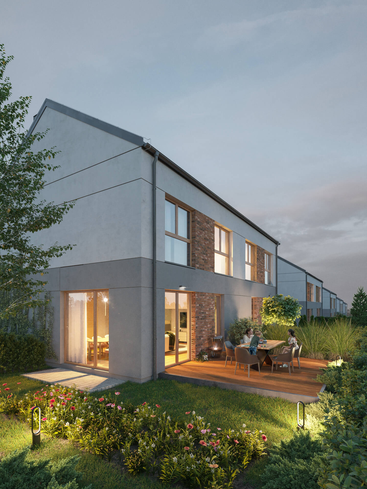 Bliźniak z elementami cegły na elewacji ogrodem i tarasem wieczorem.