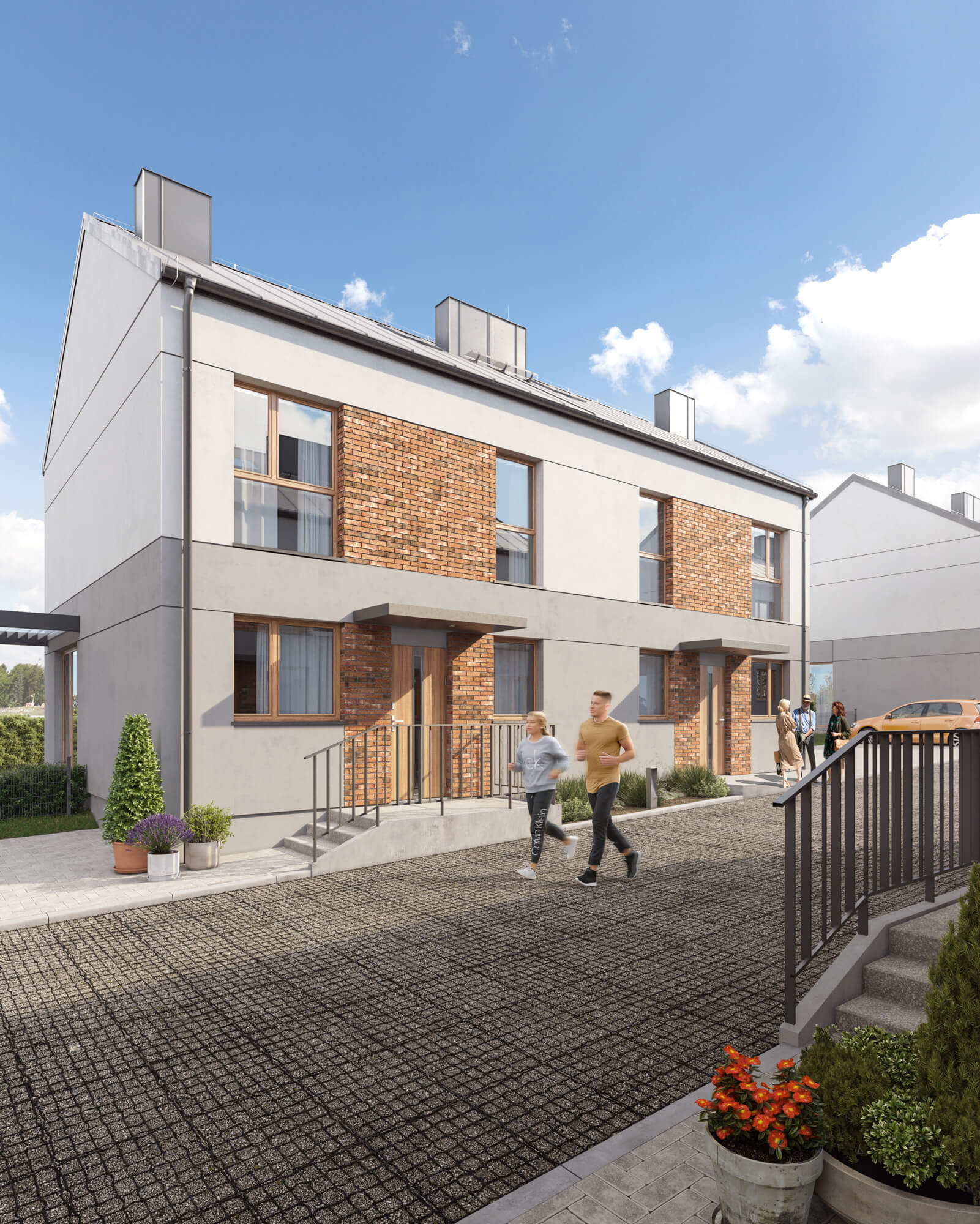 Bliźniak z elementami cegły na elewacji.