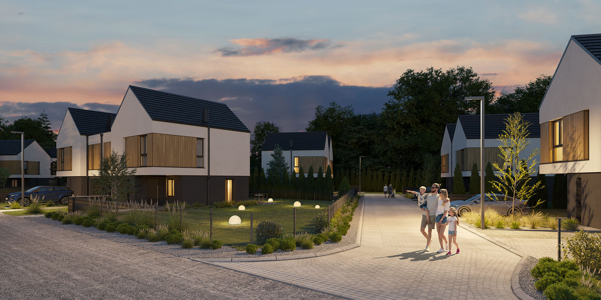 wjazd na osiedle z zabudową bliźniaczą wieczorem.