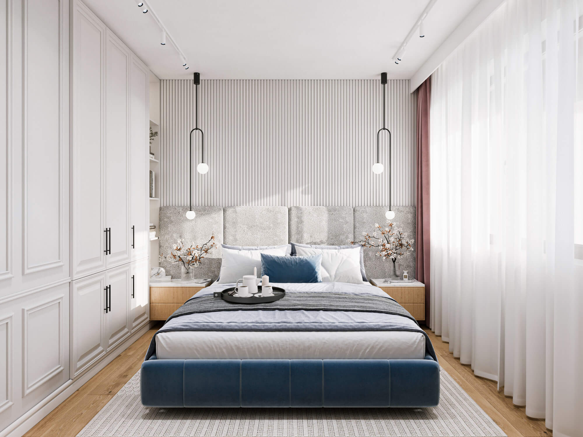 Sypialnia z dużym szarym zagłownikiem i ozdobnymi lampkami.