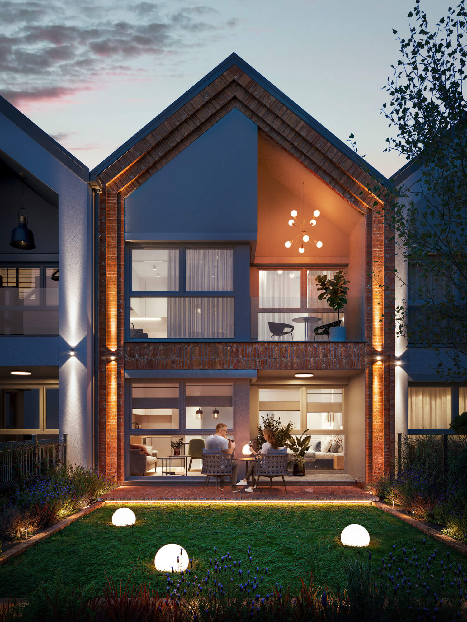 budynek szeregowy z tarasem i podświetloną elewacją wieczorem.