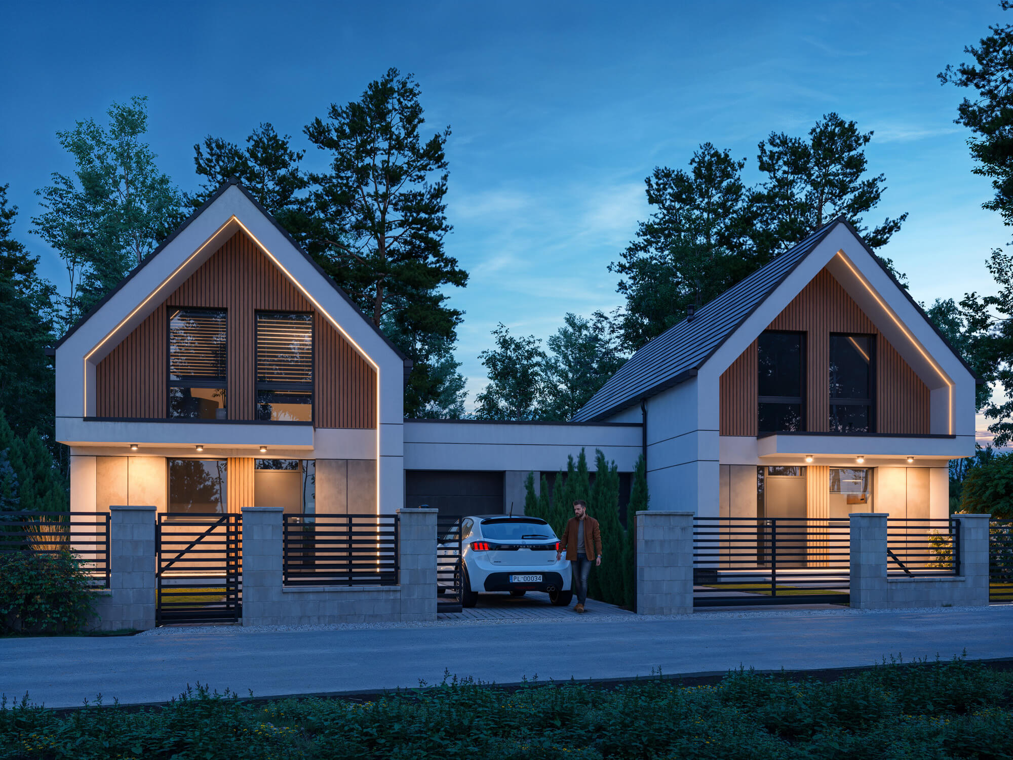 Budynek bliźniaczy z garażem i podświetlaną elewacją.