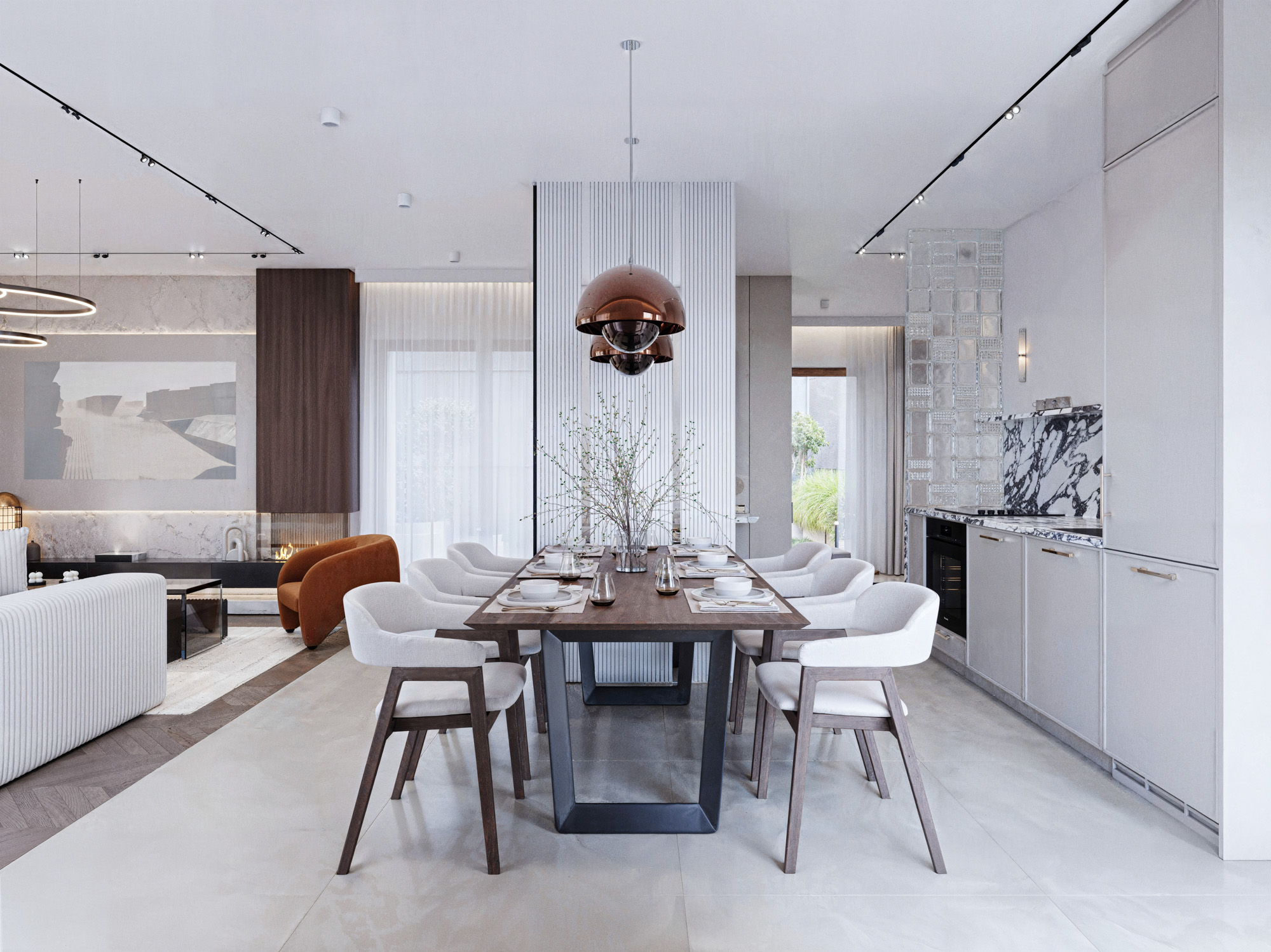 Jasna, elegancka kuchnia z kamiennym blatem i jadalnia z ozdobnymi lampami.