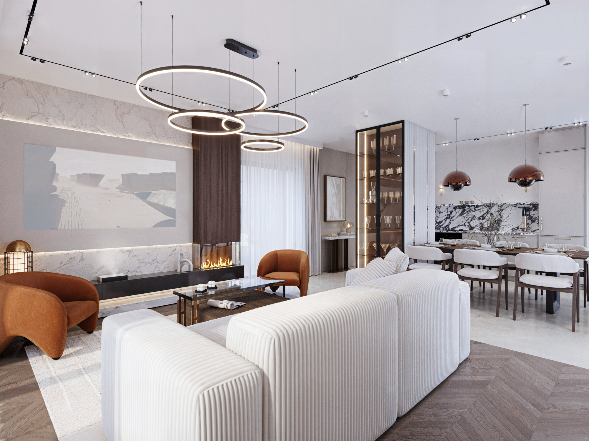 Strefa dzienna z kuchnią, jadalnią i salonem z jasną kanapą.