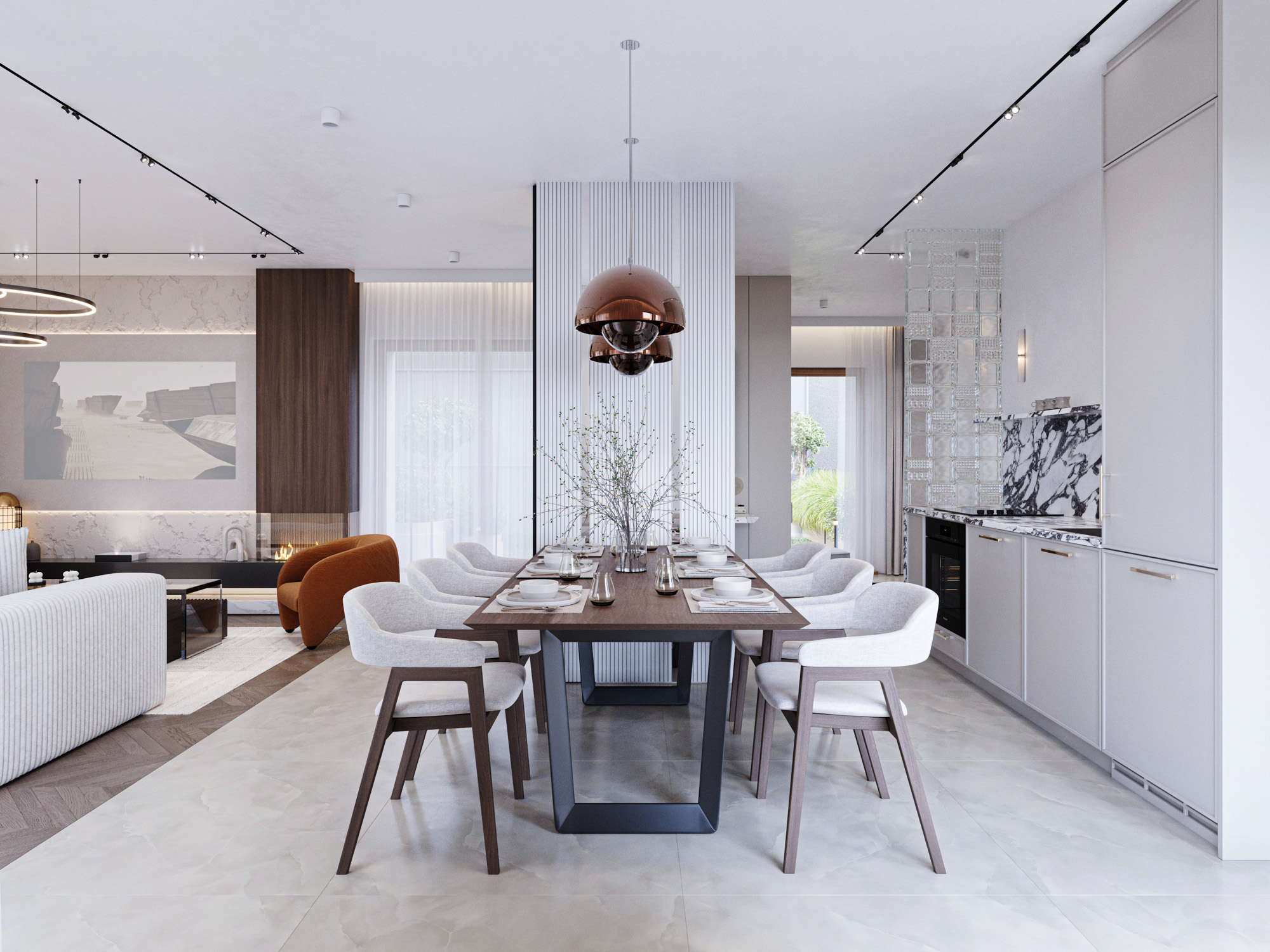 Jasna, elegancka kuchnia z kamiennym blatem i jadalnia z ozdobnymi lampami.