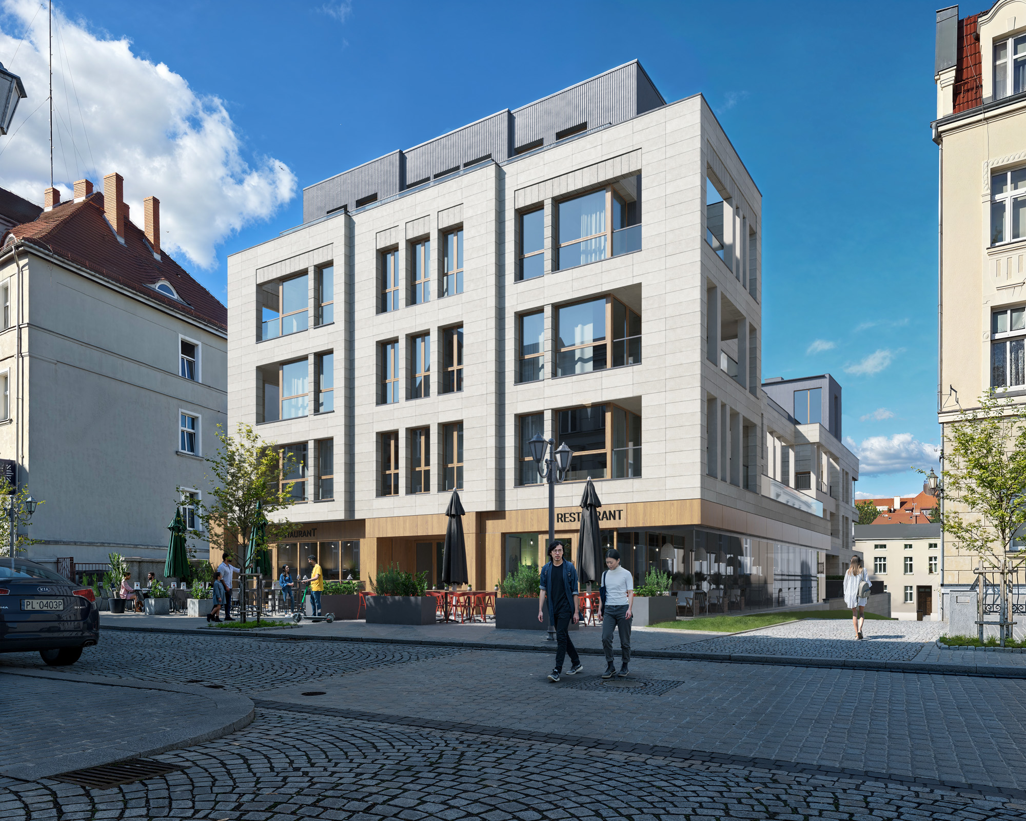 Budynek wielorodzinny z jasną elewacją i lokalami na parterze.